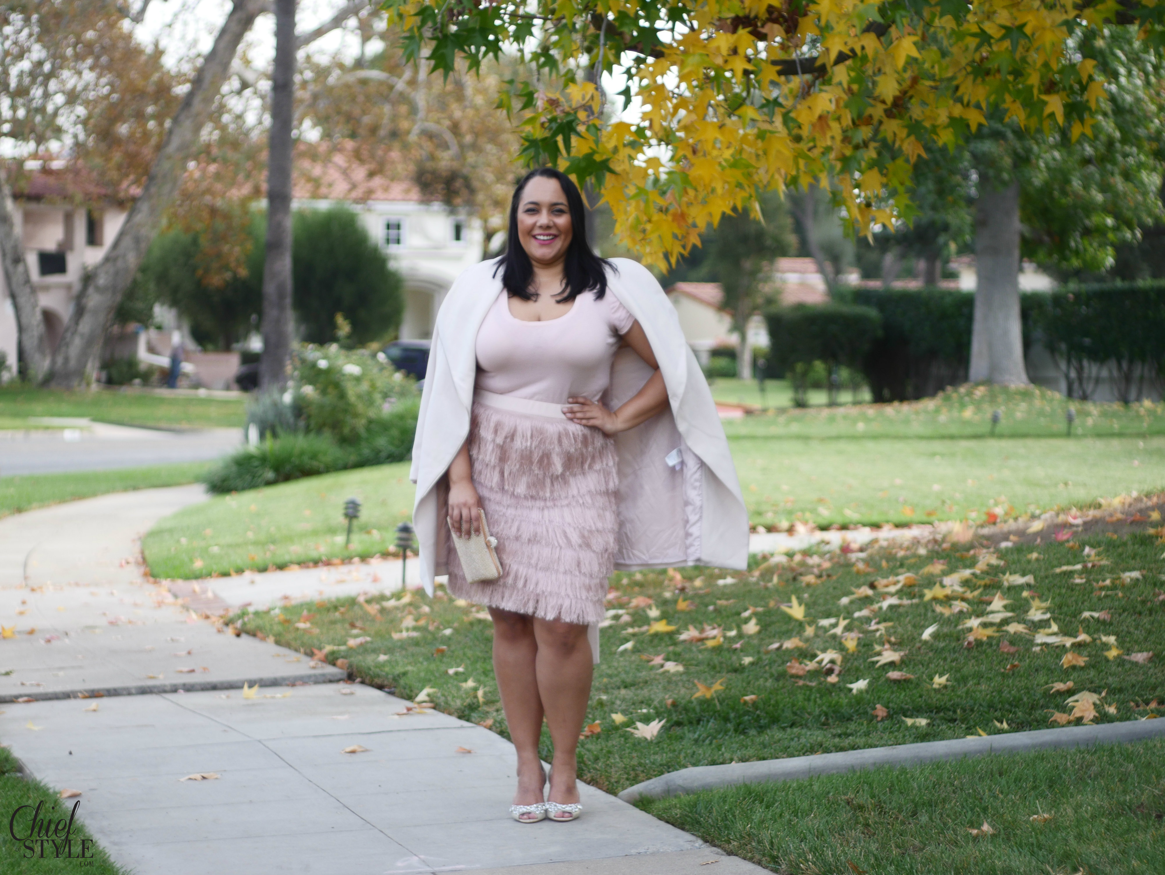 Amy Stretten Chief of Style wearing a soft pink plus size fringe pencil skirt by Eloquii